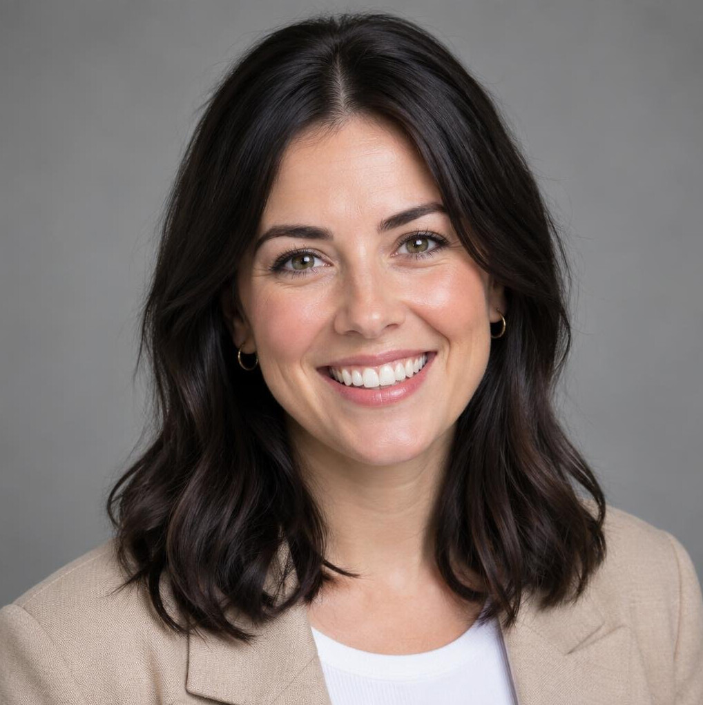 Studio portrait of a smiling young woman with dark hair